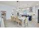 Spacious living area with dining table, leading to an open concept kitchen and stainless steel appliances at 3041 Robeson Trce, Johns Island, SC 29455