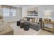 Inviting living room featuring a comfortable couch, accent tables, and a large window, perfect for relaxing at 3041 Robeson Trce, Johns Island, SC 29455