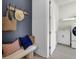 Convenient mudroom with seating, hooks, and access to the laundry room at 3041 Robeson Trce, Johns Island, SC 29455
