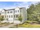 Beautiful townhome with a two-car garage and curb appeal enhanced by manicured landscaping at 422 Caledon Ct, Johns Island, SC 29455
