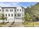 Charming townhome with a two-car garage, complemented by tasteful landscaping and a welcoming entrance at 422 Caledon Ct, Johns Island, SC 29455