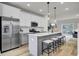 Modern kitchen featuring stainless steel appliances and a sleek island with bar stool seating at 422 Caledon Ct, Johns Island, SC 29455