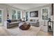Spacious living room with two comfortable sofas, a geometric coffee table, and lots of natural light at 422 Caledon Ct, Johns Island, SC 29455