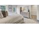 Comfortable primary bedroom featuring a dresser and open doorway to a walk-in closet at 422 Caledon Ct, Johns Island, SC 29455
