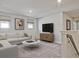 Cozy upstairs living room with neutral carpet, a comfortable sofa, and a TV at 422 Radiant Blue Way, Summerville, SC 29486