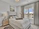 Bedroom featuring a plush bed with modern design and a window with natural lighting at 424 Caledon Ct, Johns Island, SC 29455