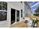 Spacious deck with outdoor seating, wooden railings, and sliding door entry at 424 Caledon Ct, Johns Island, SC 29455