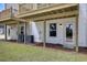 Rear view of townhome shows siding, porch and door to the exterior at 424 Caledon Ct, Johns Island, SC 29455