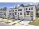 Row of new townhomes feature multi-tone color schemes, and attached garages, adding curb appeal and convenience at 424 Caledon Ct, Johns Island, SC 29455