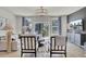 Bright living room with neutral tones, stylish seating, and sliding glass doors to an outdoor deck at 424 Caledon Ct, Johns Island, SC 29455