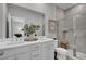 Bright main bathroom with double vanity, tiled shower, and modern fixtures at 424 Caledon Ct, Johns Island, SC 29455