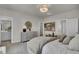 Relaxing bedroom with a neutral color scheme, comfortable bed, and a dresser with decorative accents at 424 Caledon Ct, Johns Island, SC 29455