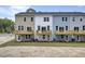 New construction townhomes with private decks and ground-level patio access at 424 Caledon Ct, Johns Island, SC 29455