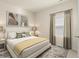 Inviting bedroom with a plush bed, neutral tones, and geometric patterned rug at 424 Radiant Blue Way, Summerville, SC 29486