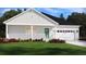 Charming single-story home featuring a welcoming front porch and attached two-car garage at 424 Radiant Blue Way, Summerville, SC 29486