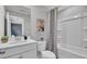 Clean bathroom featuring a shower/tub combo, vanity with solid surface counter, and stylish decor at 477 Caledon Ct, Johns Island, SC 29455