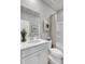 Bright bathroom with a modern vanity, framed art, and a shower/tub combo behind a shower curtain at 477 Caledon Ct, Johns Island, SC 29455