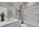 Bright bathroom with a modern vanity, framed art, and a shower/tub combo behind a shower curtain at 477 Caledon Ct, Johns Island, SC 29455