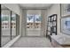 Cozy bedroom with natural light streaming through a window and black shelving providing modern decor at 477 Caledon Ct, Johns Island, SC 29455