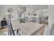 An open-concept dining room showcases stylish decor and flows into a modern kitchen at 477 Caledon Ct, Johns Island, SC 29455
