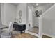 Inviting entryway featuring stylish decor, an adjacent powder room, and staircase at 477 Caledon Ct, Johns Island, SC 29455