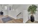 View of hallway with wooden floors, staircase, and potted plant at 477 Caledon Ct, Johns Island, SC 29455
