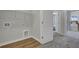Laundry room features a wire rack shelf for storage and is conveniently located near a bedroom at 477 Caledon Ct, Johns Island, SC 29455