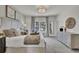 Relaxing main bedroom with neutral tones, a plush bed, and ample natural light at 477 Caledon Ct, Johns Island, SC 29455