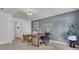 Bright office space with modern decor, including a wooden desk, stylish seating, and ample light at 477 Caledon Ct, Johns Island, SC 29455