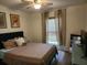 Comfortable bedroom with ceiling fan and window with patterned curtains at 514 Woodward Blvd, Summerville, SC 29483