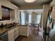 Kitchen showcasing granite countertops, white cabinets, and access to a bright dining area at 514 Woodward Blvd, Summerville, SC 29483