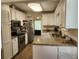 Well-equipped kitchen with white cabinets, granite countertops, and stainless steel appliances at 514 Woodward Blvd, Summerville, SC 29483