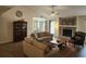 Open-concept living area featuring a stone fireplace, ceiling fan, and access to dining space at 514 Woodward Blvd, Summerville, SC 29483