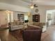 Bright living room with wood floors, ceiling fan, and built-in shelves at 514 Woodward Blvd, Summerville, SC 29483