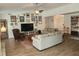 Inviting living room with vaulted ceilings, wood floors, and an array of wall decor at 514 Woodward Blvd, Summerville, SC 29483
