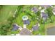 Aerial shot showcases the home's location with a private pool within a lush, green neighborhood at 5289 Mulholland Dr, Summerville, SC 29485
