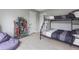 Bedroom featuring a bunk bed, comfy beanbag chair, and bookshelf, creating a cozy and inviting space at 5289 Mulholland Dr, Summerville, SC 29485