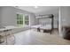 Bright bedroom features a bunk bed, desk area, and large windows at 5289 Mulholland Dr, Summerville, SC 29485