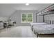 Bedroom with a bunk bed, desk, and large window, providing a functional and bright space at 5289 Mulholland Dr, Summerville, SC 29485