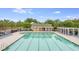Large community swimming pool with several lounge chairs and tables at 5289 Mulholland Dr, Summerville, SC 29485
