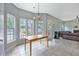 Bright dining area with lots of windows and views of the outdoor living, next to living room at 5289 Mulholland Dr, Summerville, SC 29485