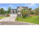 Charming two-story home with a well-manicured lawn and a spacious driveway at 5289 Mulholland Dr, Summerville, SC 29485