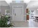 Spacious foyer with large front door, ample lighting, and vinyl flooring at 5289 Mulholland Dr, Summerville, SC 29485