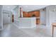 Open kitchen view with wood cabinets and adjacent dining area, great for Gathering gatherings at 5289 Mulholland Dr, Summerville, SC 29485