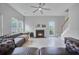 Bright and airy living room with a fireplace, light vinyl flooring, and comfortable seating at 5289 Mulholland Dr, Summerville, SC 29485