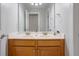Bathroom vanity with double sinks, granite countertops, and wooden cabinets, providing practical elegance at 5289 Mulholland Dr, Summerville, SC 29485