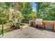 Outdoor kitchen with a built-in grill and counter space, set against a backdrop of lush greenery at 62 Eastlake Rd, Mount Pleasant, SC 29464