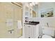 Classic bathroom featuring a shower with glass door, vanity, and stylish decor at 62 Eastlake Rd, Mount Pleasant, SC 29464