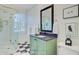 Charming bathroom featuring a glass shower and a green vanity with black countertop at 62 Eastlake Rd, Mount Pleasant, SC 29464