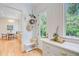 Inviting entryway with natural light, practical storage solutions, and access to the dining area at 62 Eastlake Rd, Mount Pleasant, SC 29464